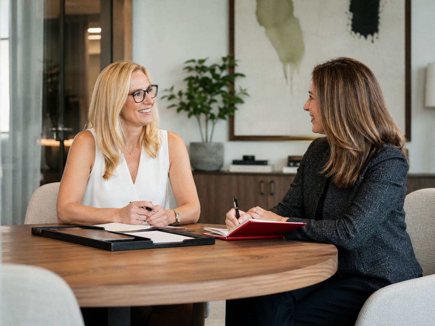 Two investment advisers meeting in a refined modern office